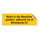 Nicht in die Maschine greifen, während sie in Bewegung ist.