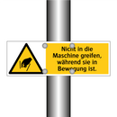 Nicht in die Maschine greifen, während sie in Bewegung ist.