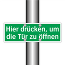 Hier drücken, um die Tür zu öffnen