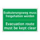 Evakuierungsweg muss freigehalten /.../ - Evacuation route must be kept /.../
