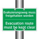 Evakuierungsweg muss freigehalten /.../ - Evacuation route must be kept /.../