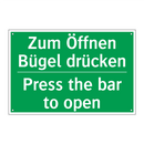 Zum Öffnen Bügel drücken - Press the bar to open
