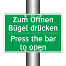 Zum Öffnen Bügel drücken - Press the bar to open
