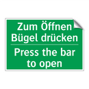 Zum Öffnen Bügel drücken - Press the bar to open