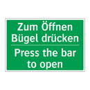 Zum Öffnen Bügel drücken - Press the bar to open