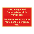 Fluchtwege und Notausgänge nicht /.../ - Do not obstruct escape routes /.../