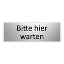 Bitte hier warten