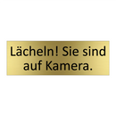 Lächeln! Sie sind auf Kamera.