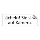 Lächeln! Sie sind auf Kamera.