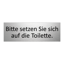 Bitte setzen Sie sich auf die Toilette.