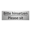 Bitte hinsetzen - Please sit