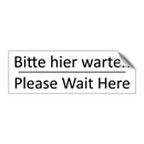 Bitte hier warten - Please Wait Here