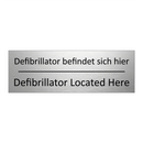 Defibrillator befindet sich hier /.../ - Defibrillator Located Here