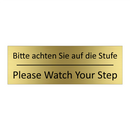 Bitte achten Sie auf die Stufe - Please Watch Your Step