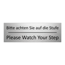 Bitte achten Sie auf die Stufe - Please Watch Your Step
