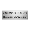 Bitte achten Sie auf die Stufe - Please Watch Your Step