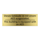 Dieses Gebäude ist mit einem AED /.../ - This building is equipped with /.../