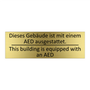 Dieses Gebäude ist mit einem AED /.../ - This building is equipped with /.../
