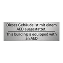 Dieses Gebäude ist mit einem AED /.../ - This building is equipped with /.../