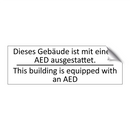 Dieses Gebäude ist mit einem AED /.../ - This building is equipped with /.../