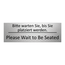 Bitte warten Sie, bis Sie platziert /.../ - Please Wait to Be Seated