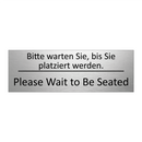 Bitte warten Sie, bis Sie platziert /.../ - Please Wait to Be Seated