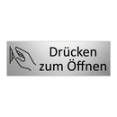 Drücken zum Öffnen