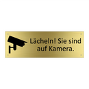 Lächeln! Sie sind auf Kamera.