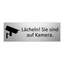 Lächeln! Sie sind auf Kamera.