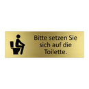 Bitte setzen Sie sich auf die Toilette.