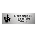 Bitte setzen Sie sich auf die Toilette.