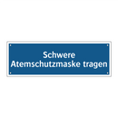 Schwere Atemschutzmaske tragen