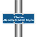 Schwere Atemschutzmaske tragen