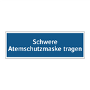 Schwere Atemschutzmaske tragen