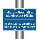 In diesem Geschäft gilt Mundschutz-Pflicht/.../ - In this store, wearing a face /.../