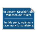 In diesem Geschäft gilt Mundschutz-Pflicht/.../ - In this store, wearing a face /.../