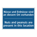 Nüsse und Erdnüsse sind an diesem /.../ - Nuts and peanuts are present in /.../