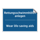 Rettungsschwimmhilfen anlegen - Wear life-saving aids