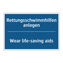 Rettungsschwimmhilfen anlegen - Wear life-saving aids