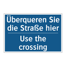 Überqueren Sie die Straße hier - Use the crossing