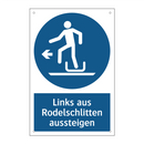 Links aus Rodelschlitten aussteigen
