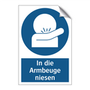 In die Armbeuge niesen
