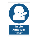 In die Armbeuge niesen