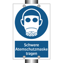 Schwere Atemschutzmaske tragen