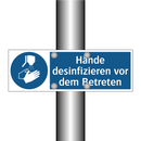 Hände desinfizieren vor dem Betreten