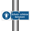 Schutz- schürze benutzen