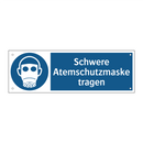 Schwere Atemschutzmaske tragen