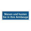 Niesen und husten Sie in Ihre Armbeuge