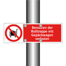 Benutzen der Rolltreppe mit Gepäckwagen verboten