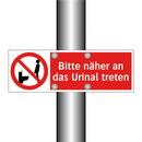 Bitte näher an das Urinal treten